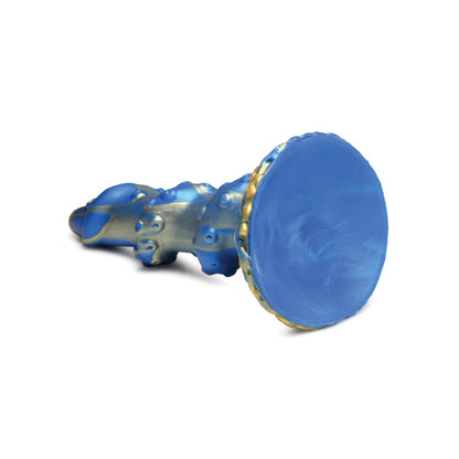 The Creature Cocks Lord Kraken Silicone Dildo, by Creature Cocks, features an intricate blue and gold design with a textured handle and round base, evoking a deep-sea fantasy reminiscent of a decorative sculpture against a plain white background.