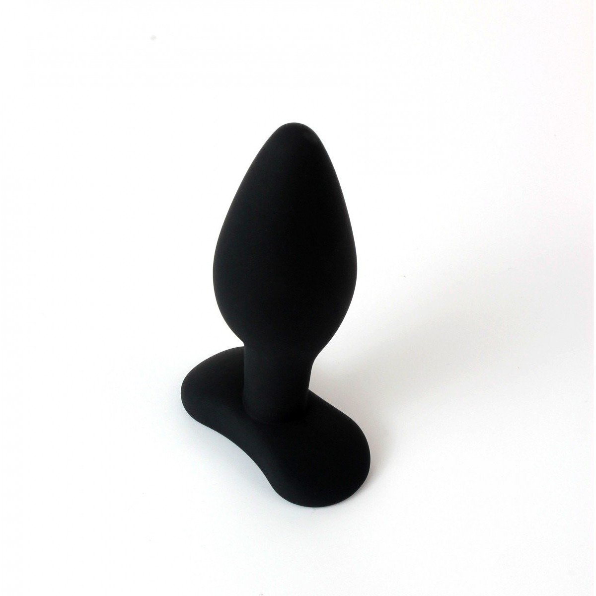The Pipedream Anal Fantasy Collection 100% Silicone Small Butt Plug, featuring a sleek black design with a tapered shape and flared base, elegantly stands on a pristine white background.