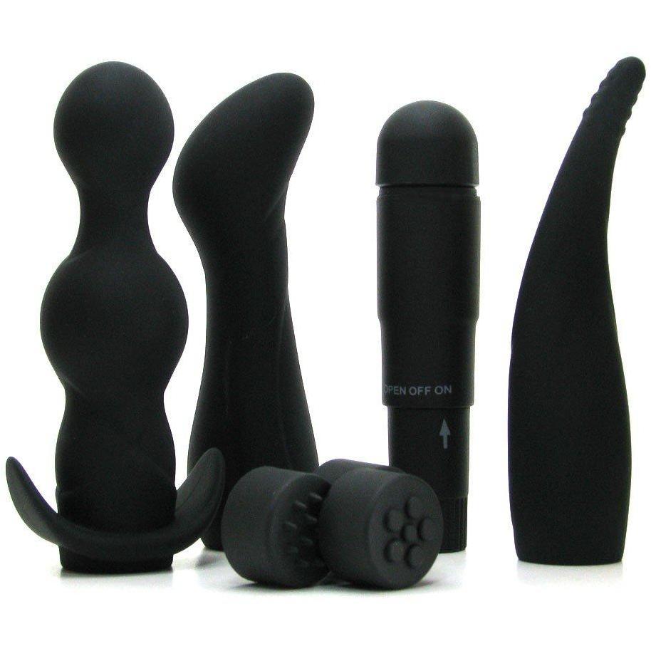 Introducing the Anal Fantasy Collection Anal Adventure Kit by Pipedream: a sleek black silicone set featuring a beaded plug, curved massager, classic vibrator, and two small textured attachments. Perfect for exploration and excitement.