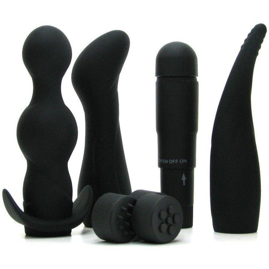 Introducing the Anal Fantasy Collection Anal Adventure Kit by Pipedream: a sleek black silicone set featuring a beaded plug, curved massager, classic vibrator, and two small textured attachments. Perfect for exploration and excitement.