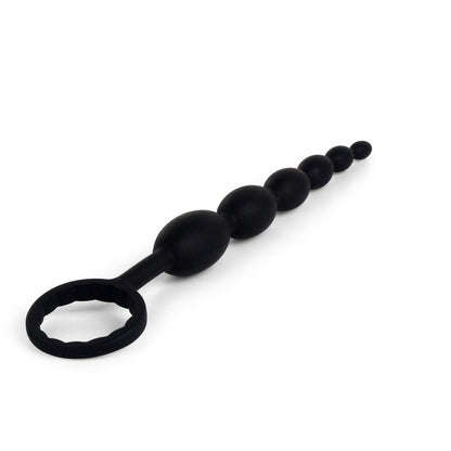 The Pipedream Anal Fantasy First Time Fun Anal Beads, ideal for beginners, showcase graduated black silicone beads with a loop handle set against a white background and include a free prep kit.