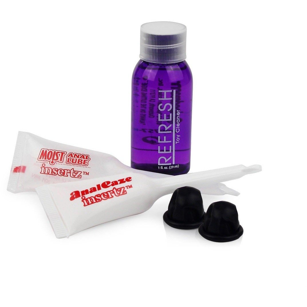 The Anal Fantasy First Time Fun Anal Beads with Free Prep Kit by Pipedream includes a bottle of purple Refresh toy cleaner, two white packets of Moist Anal Lube, two black caps, and beginner-friendly silicone anal beads.