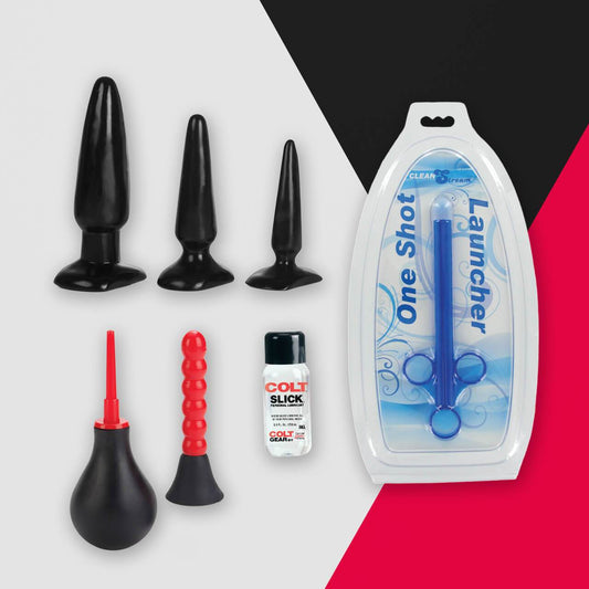 The Anal Starter Kit by Adams Toy Box includes three black anal plugs, a red nozzle with a black bulb, a red bead toy, and a bottle labeled COLT SLICK, all showcased against a striking tri-color background with packaging marked One Shot Launcher.