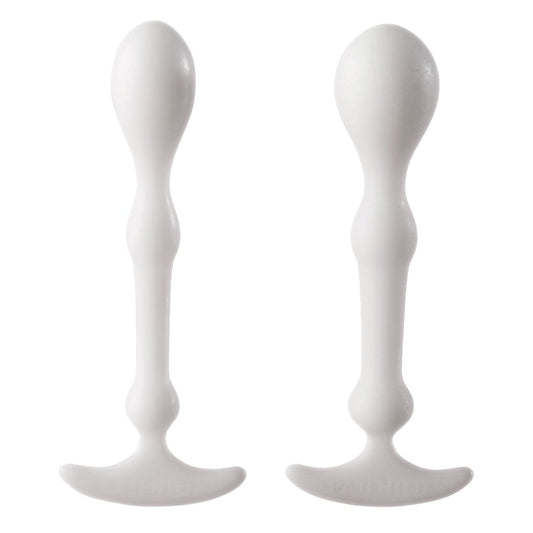 Two white, elongated plastic objects with a curved base stand upright side by side; designed for anal play, featuring a smooth surface and bulbous top tapering in the middle, reminiscent of the Aneros Peridise Set - Pack of 2.