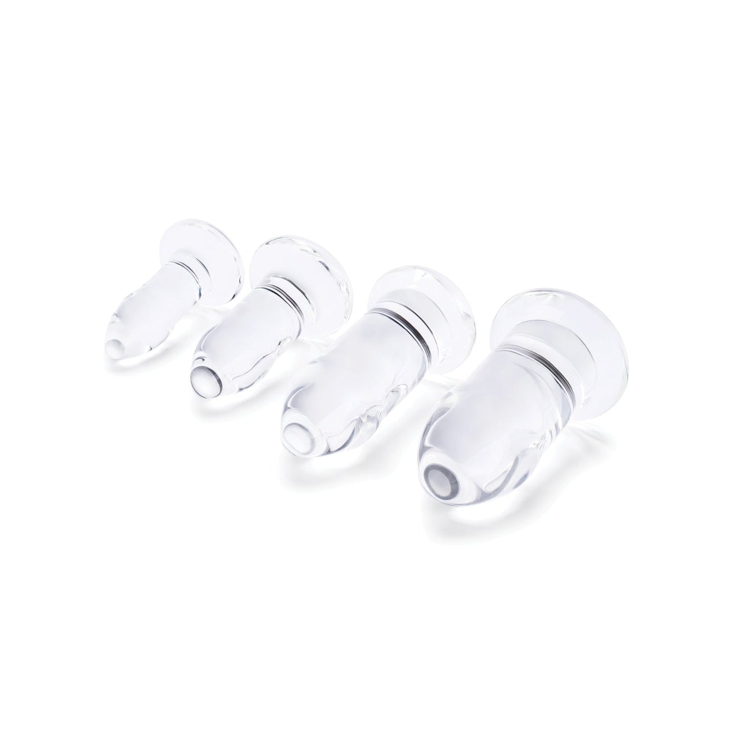 Four b-Vibe Glass Anal Dilators, crafted from body-safe materials and designed with flared edges for optimal comfort, are arranged in a row by size against a white background.