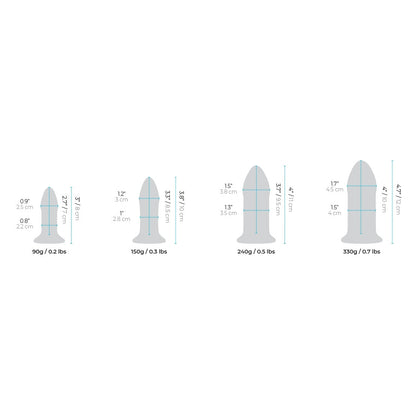 The b-Vibe Glass Anal Dilator 4 pc Set by b-vibe features an illustration of four sizes for temperature play, crafted from hypoallergenic body-safe materials: 90g/0.2lbs (9cm), 150g/0.3lbs (12cm), and two at 260g/0.5lbs and 330g/0.7lbs (both 15cm). Heights range from 9cm to 15cm.