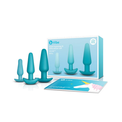 The b-Vibe Anal Education Set, by b-vibe, is a teal set featuring three differently sized butt plugs and an instructional guide. The packaging displays branding and product information in the background.