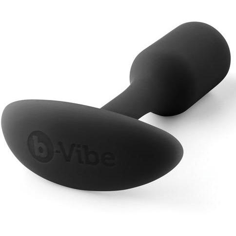 The B-Vibe Snug Butt Plug 1 by b-vibe is a black, body-safe silicone plug with a tapered end and rounded flat handle. The brands name is embossed on the smooth, ergonomic surface for comfort, ensuring safety and reliability with its 100% silicone design.