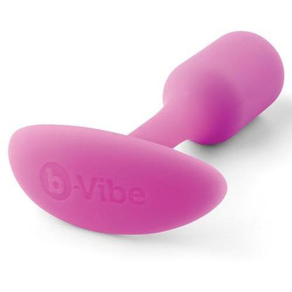 The B-Vibe Snug Butt Plug 1 by b-vibe is a pink, T-shaped base butt plug made from 100% body-safe silicone. Its weighted for comfortable and safe use, with a smooth, slightly tapered shape for easy insertion.