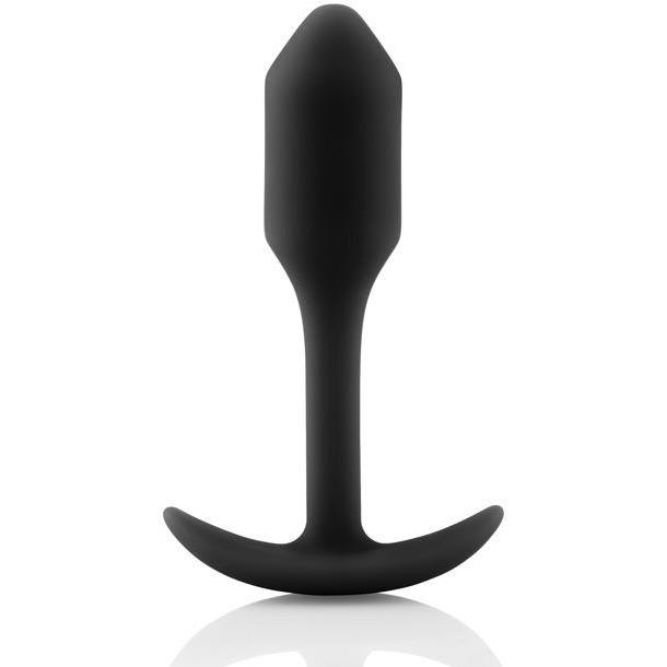 The B-Vibe Snug Butt Plug 1 from b-vibe, made of black 100% silicone, features a tapered tip and curved base. It is showcased upright against a white background, highlighting its body-safe design.