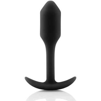 The B-Vibe Snug Butt Plug 1 from b-vibe, made of black 100% silicone, features a tapered tip and curved base. It is showcased upright against a white background, highlighting its body-safe design.