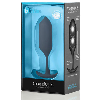 The image displays the packaging of the b-vibe Snug Plug 3, a body-safe weighted silicone plug ideal for extended wear. The blue and black box highlights its comfort-focused design and discreet use, emphasizing its thoughtful design for enhanced experience.