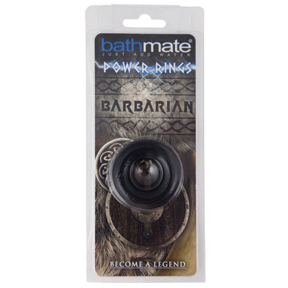 The Bathmate Barbarian Cock Ring package by Adams Toy Box displays a medieval-themed design with shields and fur, featuring the tagline Become a Legend. Inside is a ring made from flexible rubber material for long-lasting erections.