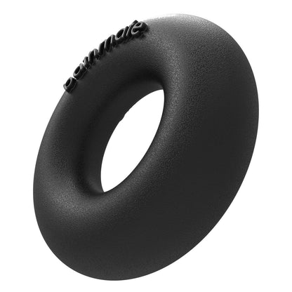 A black, textured rubber ring resembling a doughnut, with penmate embossed on it, is the Bathmate Barbarian Cock Ring by Adams Toy Box, shown against a white background.