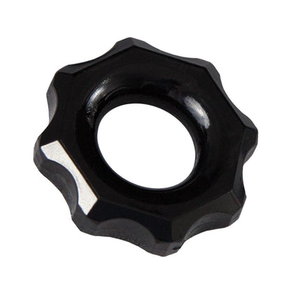A black Bathmate Spartan Cock Ring from Adams Toy Box, featuring a ridged, gear-like design with a central hole, is set against a white background, evoking the bold style of male rings.