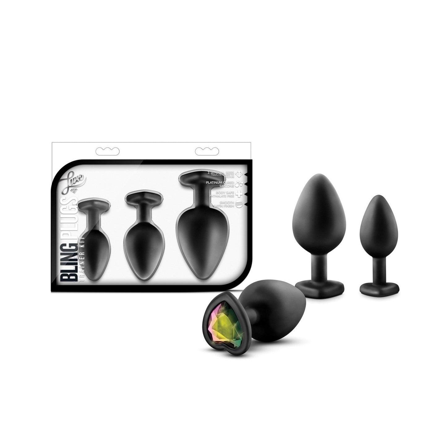 The Blush Luxe Bling Plugs with Gems by Swiss Navy are a set of three black silicone plugs adorned with faux gemstones at the base. Labeled Bling Plugs, they come in various sizes and are packaged for anal training, with the body-safe plugs displayed outside the box.