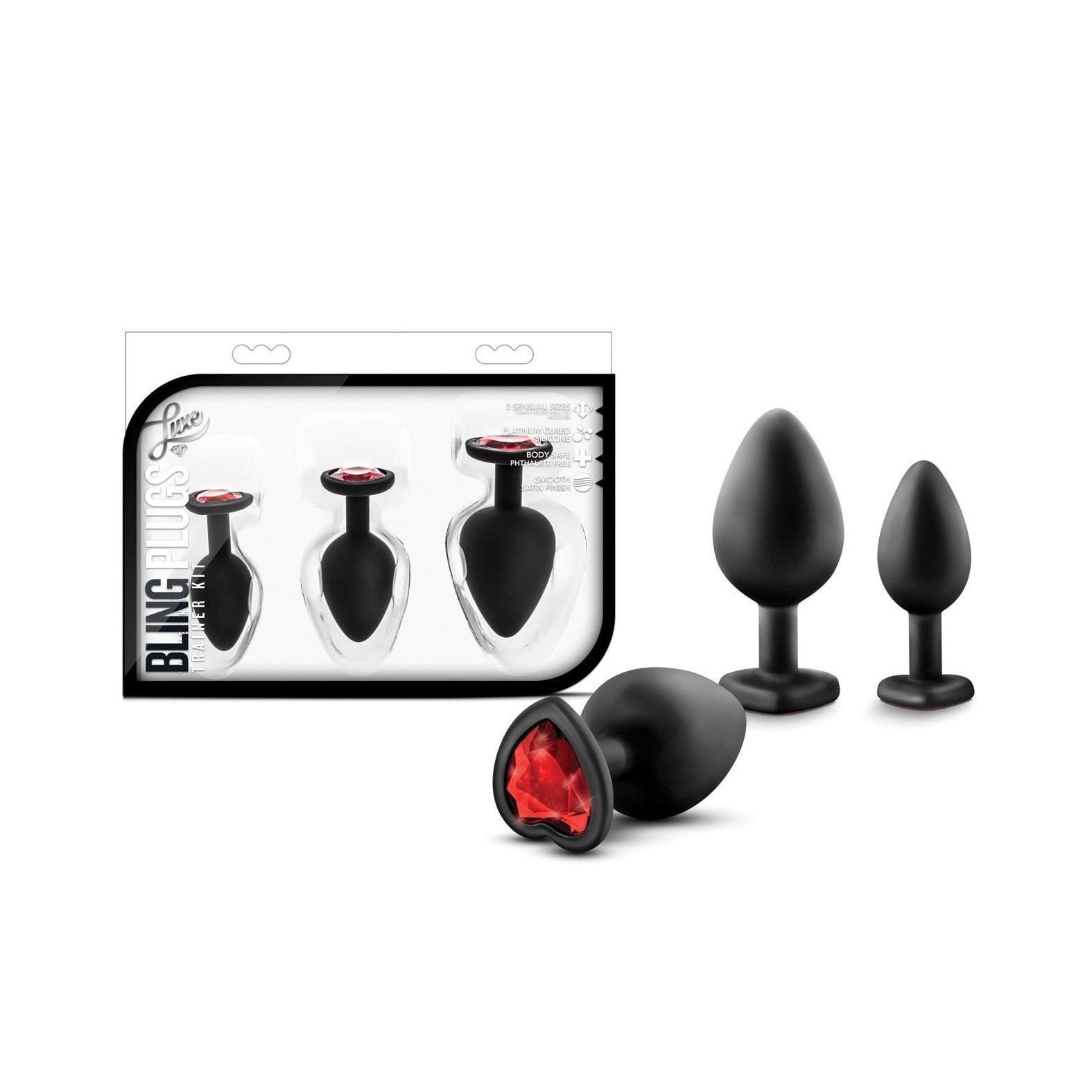 Three body-safe black silicone plugs with red faux gemstones, called Blush Luxe Bling Plugs with Gems by Swiss Navy, are displayed beside their packaging. The box showcases them in size order, perfect for anal training and progressive use.