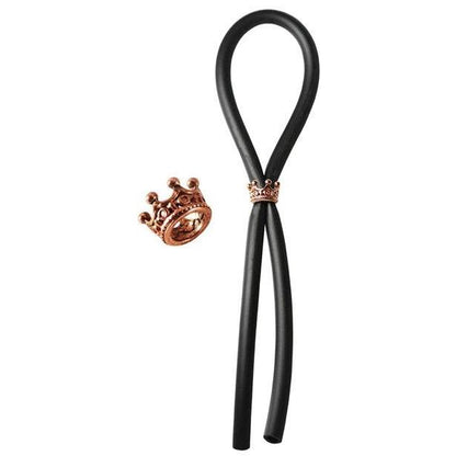 The Bolo Silicone Lasso by Adams Toy Box is a black hair styling tool with a durable silicone chord and features a rose gold crown-shaped slider ring for hairstyling.