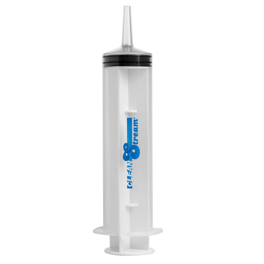 A transparent plastic enema syringe by CleanStream, featuring a cylindrical body, flat plunger, and narrow nozzle. The syringe includes the CleanStream logo in blue and is designed for effective anal hygiene.