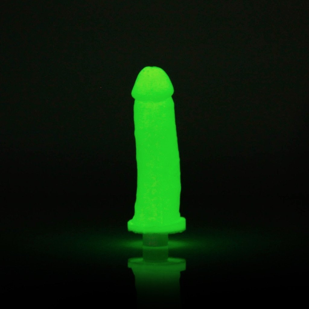 The Clone-A-Willy Kit - Vibrating by Empire Labs, a neon green silicone rod-shaped toy, stands glowing against a dark backdrop.