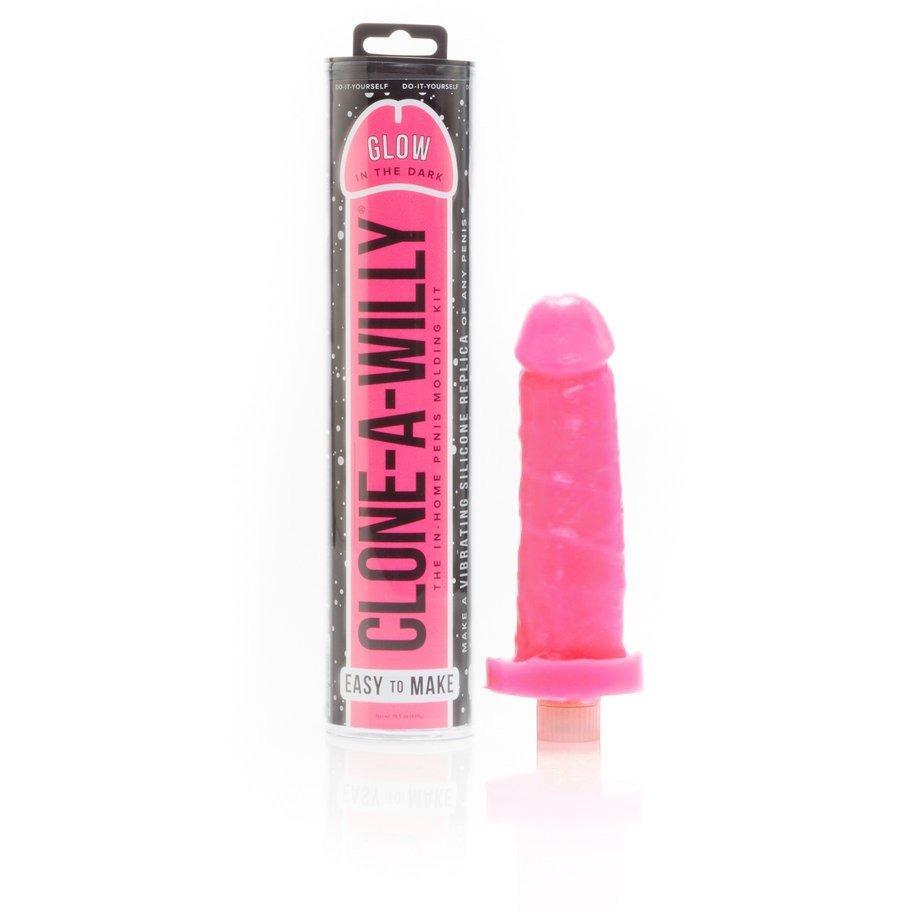 A pink Clone-A-Willy Kit - Vibrating by Empire Labs includes cylindrical packaging with Glow in the Dark text and a vibrant pink, body-safe silicone penis replica.