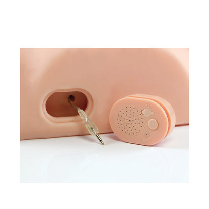 A close-up of the USB rechargeable Dirty Talk PDX Fuck Him Silly Masturbator shows its speaker and 3.5mm audio jack on a peach-colored surface, featuring buttons and motion-activated dirty talk for an immersive experience.