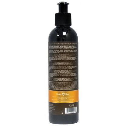 Back view of a black pump dispenser bottle containing Earthly Body Hemp Seed Massage Lotion, with white and black text on the rear label above a yellow section.