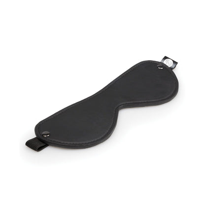 A black leather-curved sleep mask with an adjustable strap from Easy Toys sits on a white background, ideal for pairing with the Easy Toys Beginners 6 Piece Kit to enhance playful exploration.