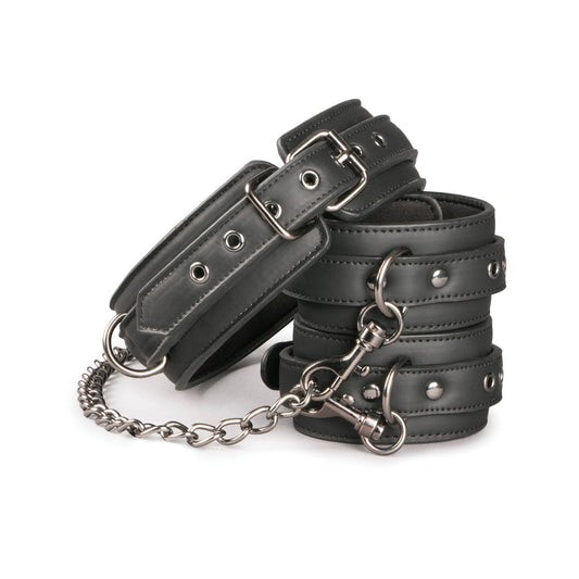 The Easy Toys Faux Leather Collar with Handcuffs is a sleek set of adjustable black restraints featuring metal buckles and rivets, linked by chains and clips. Ideal for securing wrists or ankles in various positions, these BDSM essentials offer versatile play options.