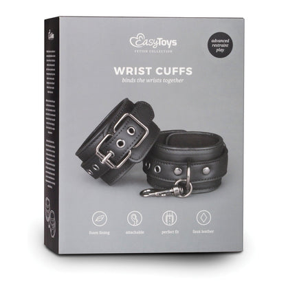 The Easy Toys Faux Leather Handcuffs box highlights black faux leather design with metal buckles and a clasp. Featuring foam lining, a perfect fit, and versatility for advanced bondage play, these adjustable cuffs ensure comfort and control.
