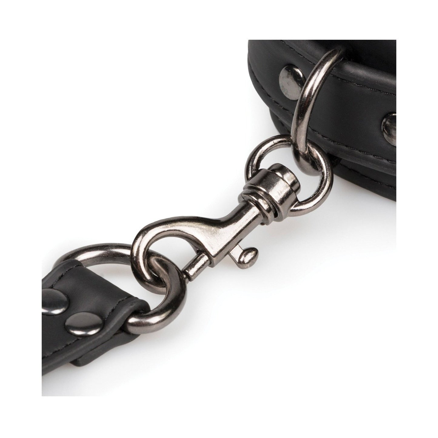 A close-up of the Easy Toys Faux Leather Hogtie shows a shiny silver swivel snap hook attached to a black faux leather strap, featuring metal studs and stitching. The loop connects it elegantly to a thicker strap, ideal for restraint setups.
