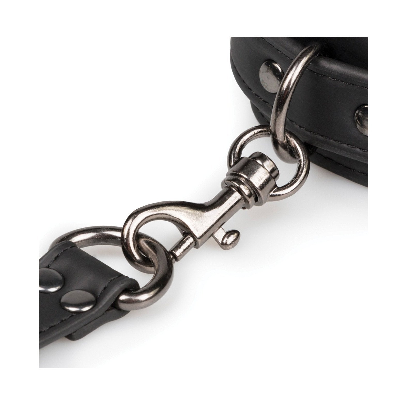 A close-up of the Easy Toys Faux Leather Hogtie shows a shiny silver swivel snap hook attached to a black faux leather strap, featuring metal studs and stitching. The loop connects it elegantly to a thicker strap, ideal for restraint setups.