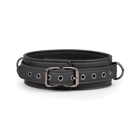 The Easy Toys Fetish Collar & Leash by Easy Toys is a black faux leather collar with metal eyelets, a shiny metallic buckle, and two D-rings for leash attachment. It adjusts smoothly and is displayed flat on a white background.
