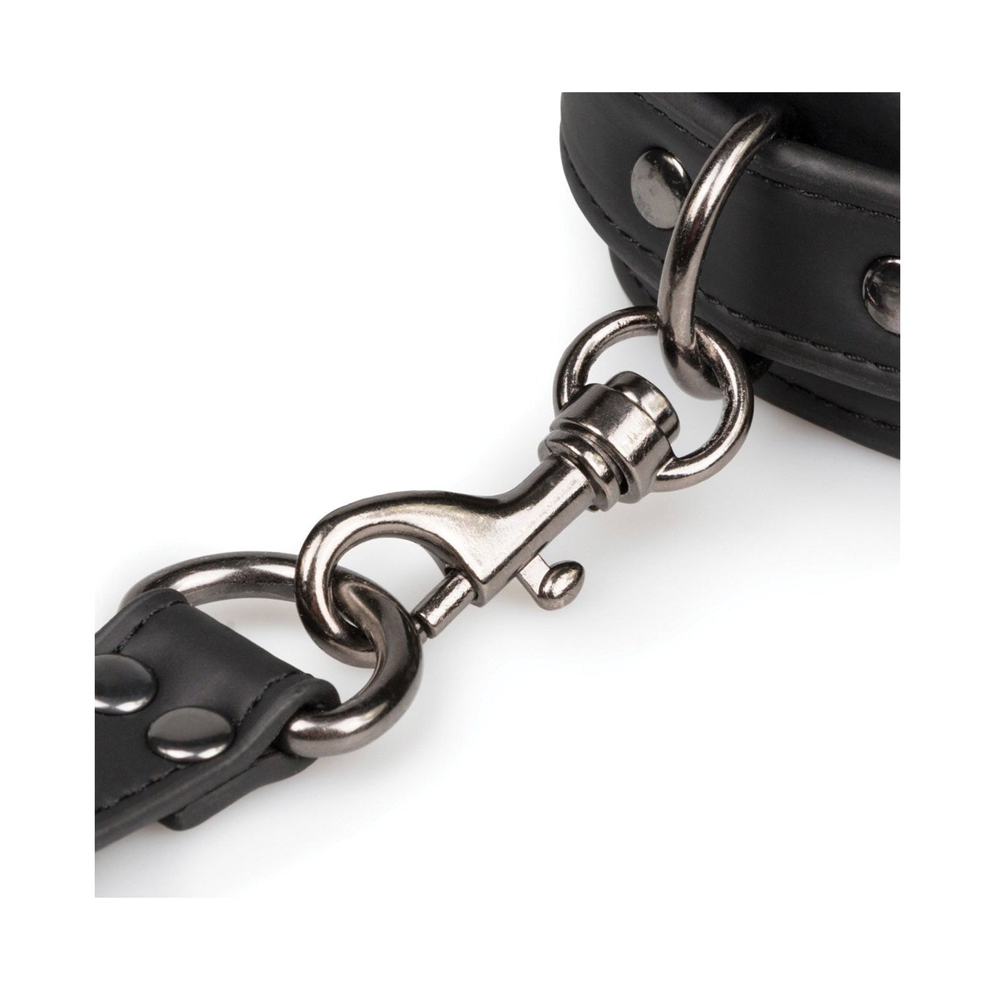 A close-up of a metal clasp connects two black leather straps with rivets, typical of durable fasteners in bondage gear. These straps could be part of the Easy Toys Hogtie with Hand & Ankle Cuffs by Easy Toys, featuring an adjustable cuff set.