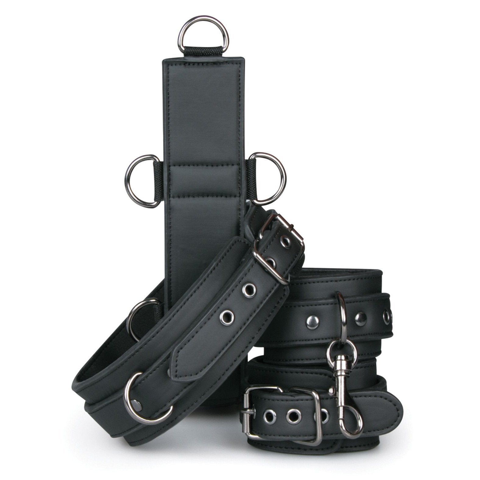 The Easy Toys Neck To Wrist Restraint Set by Adams Toy Box features sleek black faux leather restraints with silver buckles and rings, including wrist and ankle cuffs. A matching collar harness enhances the set, arranged on a white background.