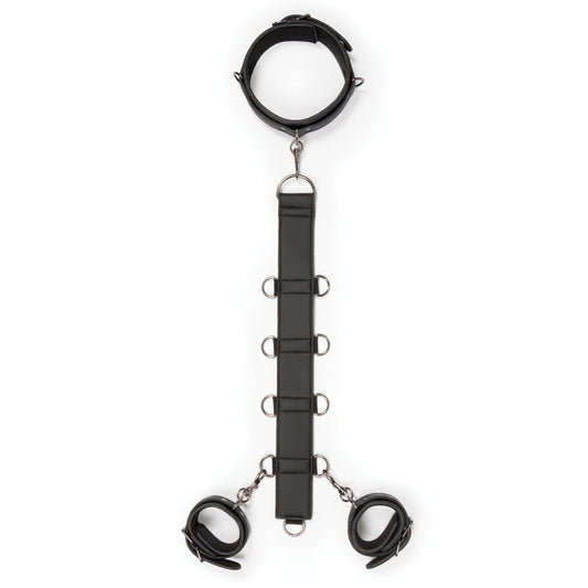 The Easy Toys Neck To Wrist Restraint Set by Adams Toy Box, crafted from black faux leather, includes a collar with a vertical strap featuring metal rings and two wrist cuffs connected by metal clips. This stylish BDSM set is elegantly showcased on a plain white background.