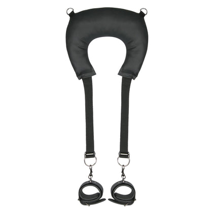 The Easy Toys Pillow & Ankle Cuffs Leg Position Strap by Adams Toy Box is a black, faux leather neck support with adjustable straps and attached wrist cuffs, designed for both comfort and restraint.
