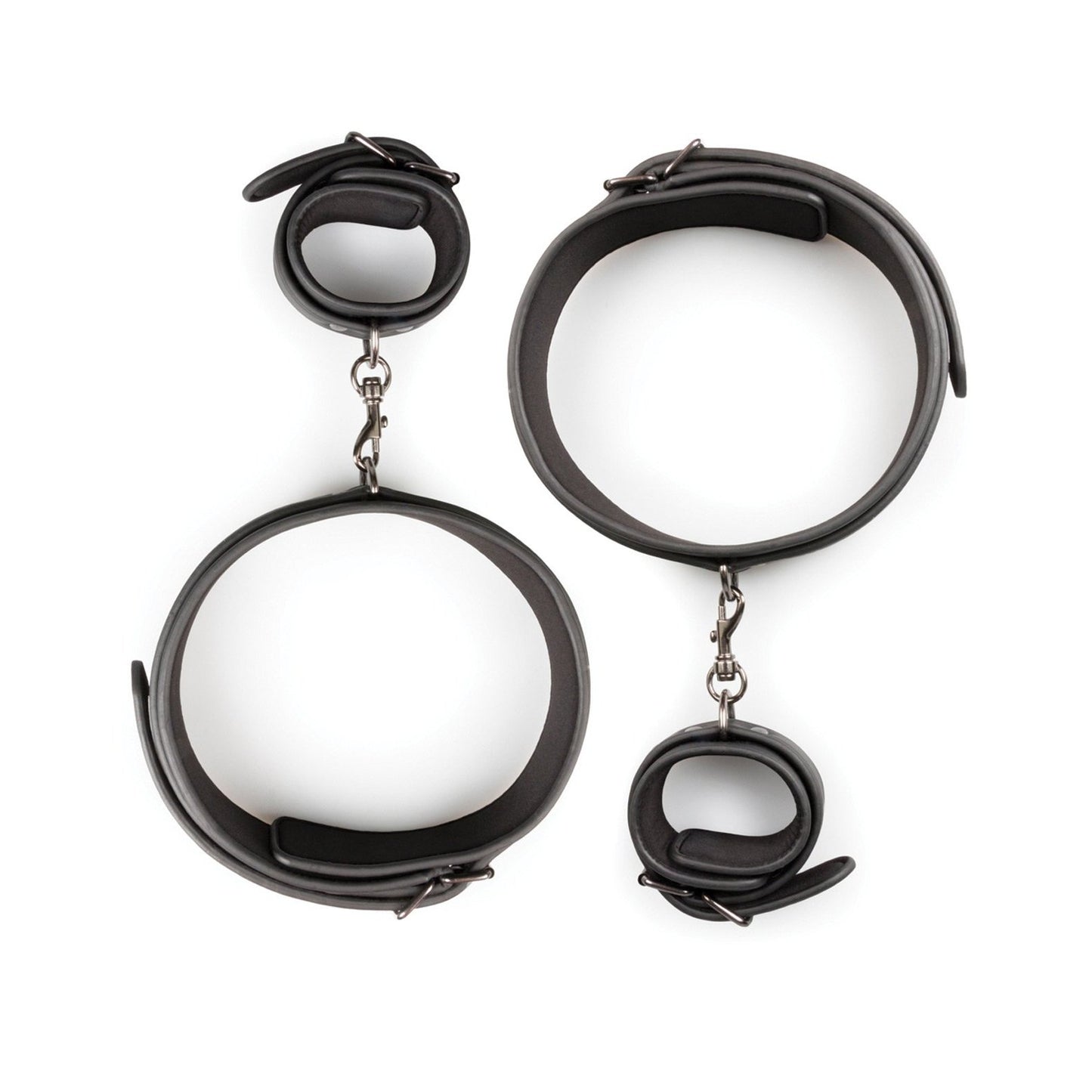 The Easy Toys Thigh & Wrist Cuff Set, a black faux leather restraint set by Easy Toys, features adjustable bondage gear with metal buckles and chains. Displayed on a pristine white background, it includes both thigh and wrist cuffs.