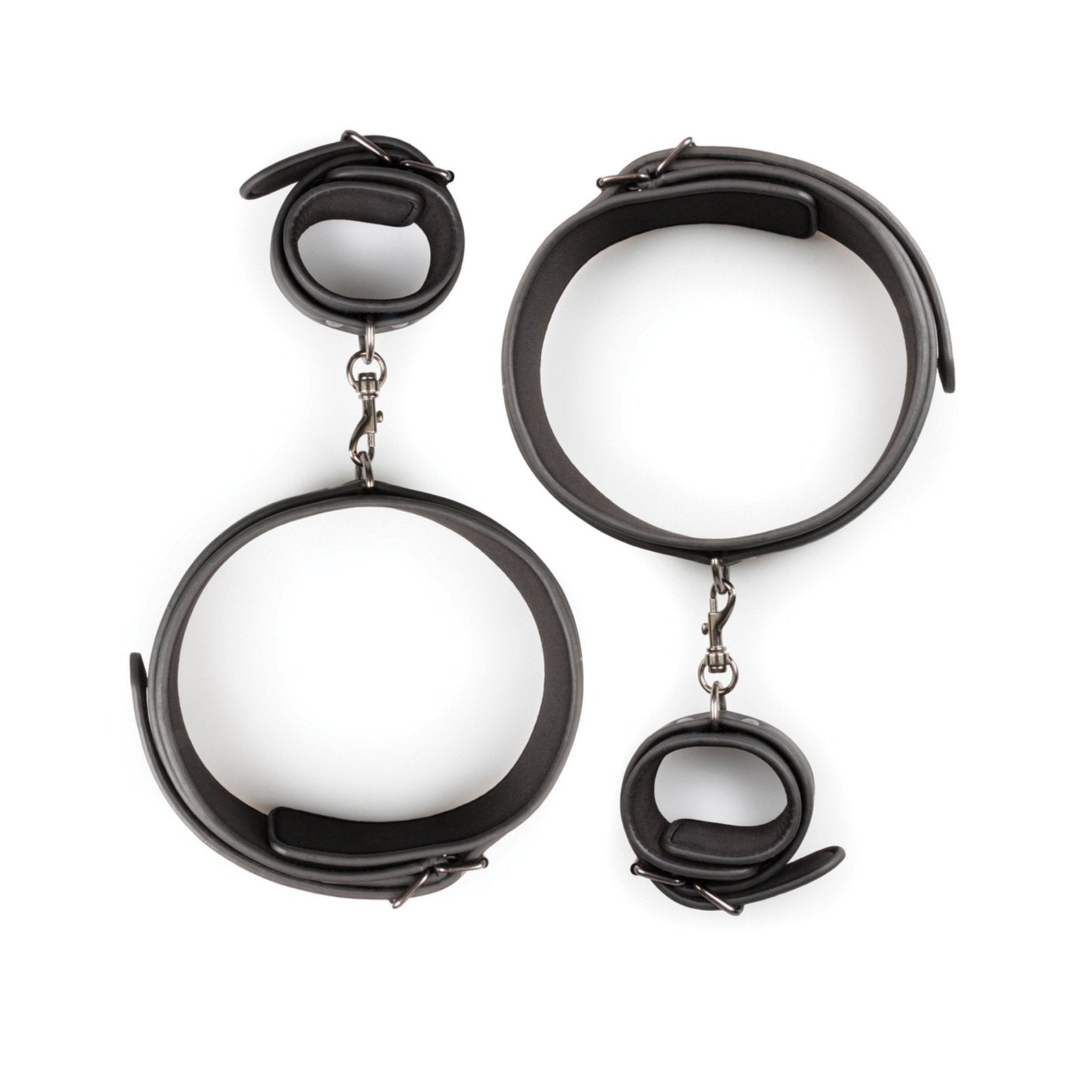 The Easy Toys Thigh & Wrist Cuff Set, a black faux leather restraint set by Easy Toys, features adjustable bondage gear with metal buckles and chains. Displayed on a pristine white background, it includes both thigh and wrist cuffs.