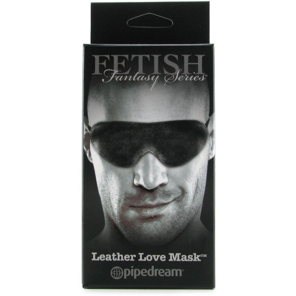 The packaging of the Fetish Fantasy Limited Edition Love Mask shows a person experiencing sensory deprivation with a sleek black mask, ideal for enhancing sex play.