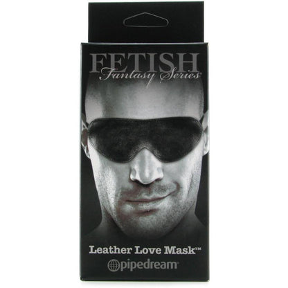 The packaging of the Fetish Fantasy Limited Edition Love Mask shows a person experiencing sensory deprivation with a sleek black mask, ideal for enhancing sex play.