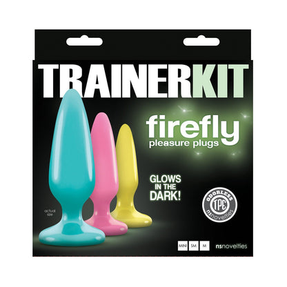 The Firefly Anal Trainer Kit by Ns Novelties INC features three glowing plugs in blue, pink, and yellow within a sleek box. Made of odorless, body-safe silicone, they include convenient suction cup bases and proudly feature Trainer Kit: Firefly Pleasure Plugs for an illuminating experience.
