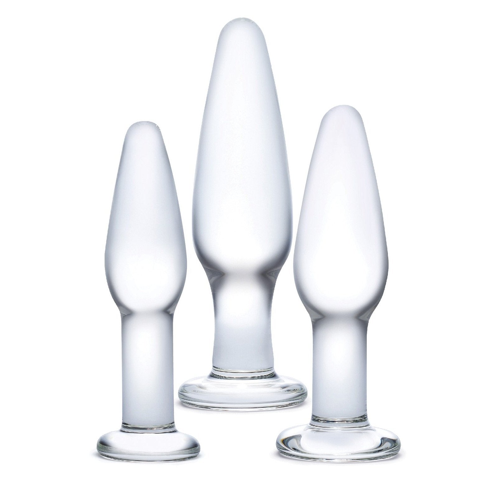 The Glas 3 pc Glass Anal Training Kit from Glas features three transparent, frosted borosilicate glass pieces of varying sizes with rounded tops and wide bases, beautifully showcasing artisanal craftsmanship against a white background.