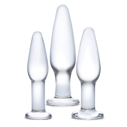The Glas 3 pc Glass Anal Training Kit from Glas features three transparent, frosted borosilicate glass pieces of varying sizes with rounded tops and wide bases, beautifully showcasing artisanal craftsmanship against a white background.