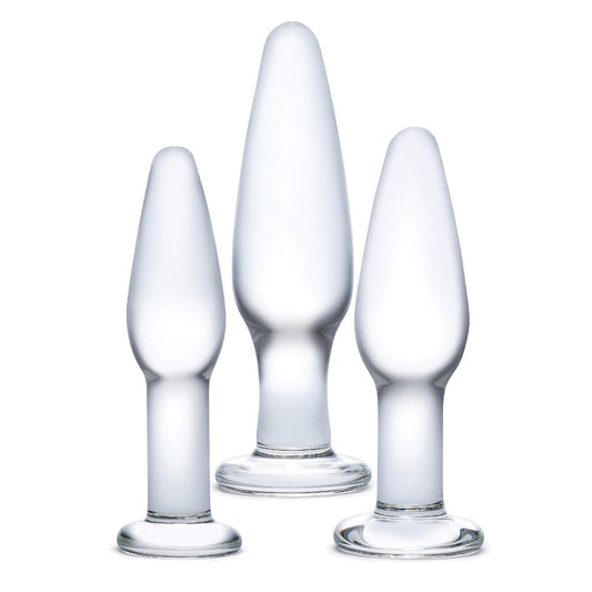 The Glas 3 pc Glass Anal Training Kit from Glas features three transparent, frosted borosilicate glass pieces of varying sizes with rounded tops and wide bases, beautifully showcasing artisanal craftsmanship against a white background.