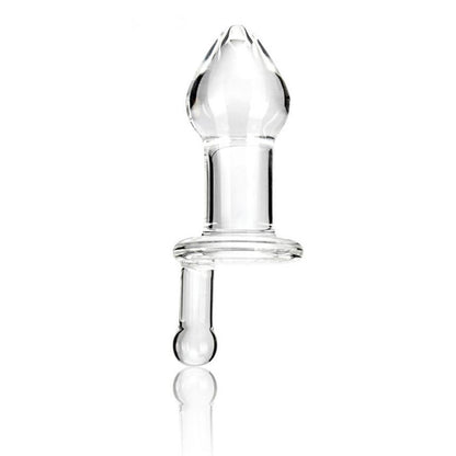 The Gläs 5 Juicer Butt Plug, a hand-made clear glass piece with a bulbous top and cylindrical base, stands upright on a white background. Its smooth, reflective surface enhances temperature play, showcasing the allure of its transparent material.