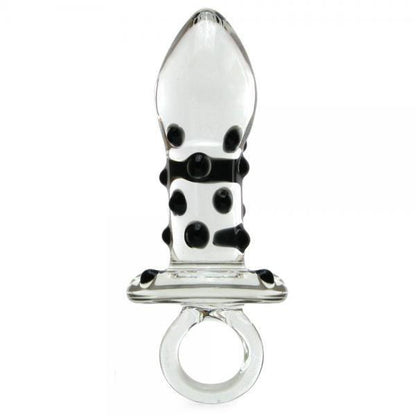 The Glas Pacifier Glass Butt Plug from Adams Toy Box is a transparent figurine with a tapered, bulbous top and a pattern of black dots. Its temperature-resistant base features a loop-like circular handle for easy grip, all showcased elegantly against a plain white background.