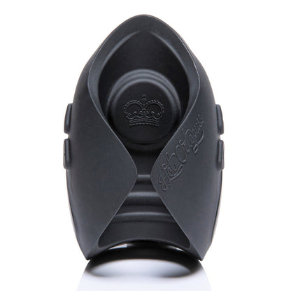 The black Hot Octopuss Pulse Solo Lux male masturbator features intricate embossing with rounded edges and royal crest details, and utilizes PulsePlate Technology. It rests elegantly on a reflective white background.