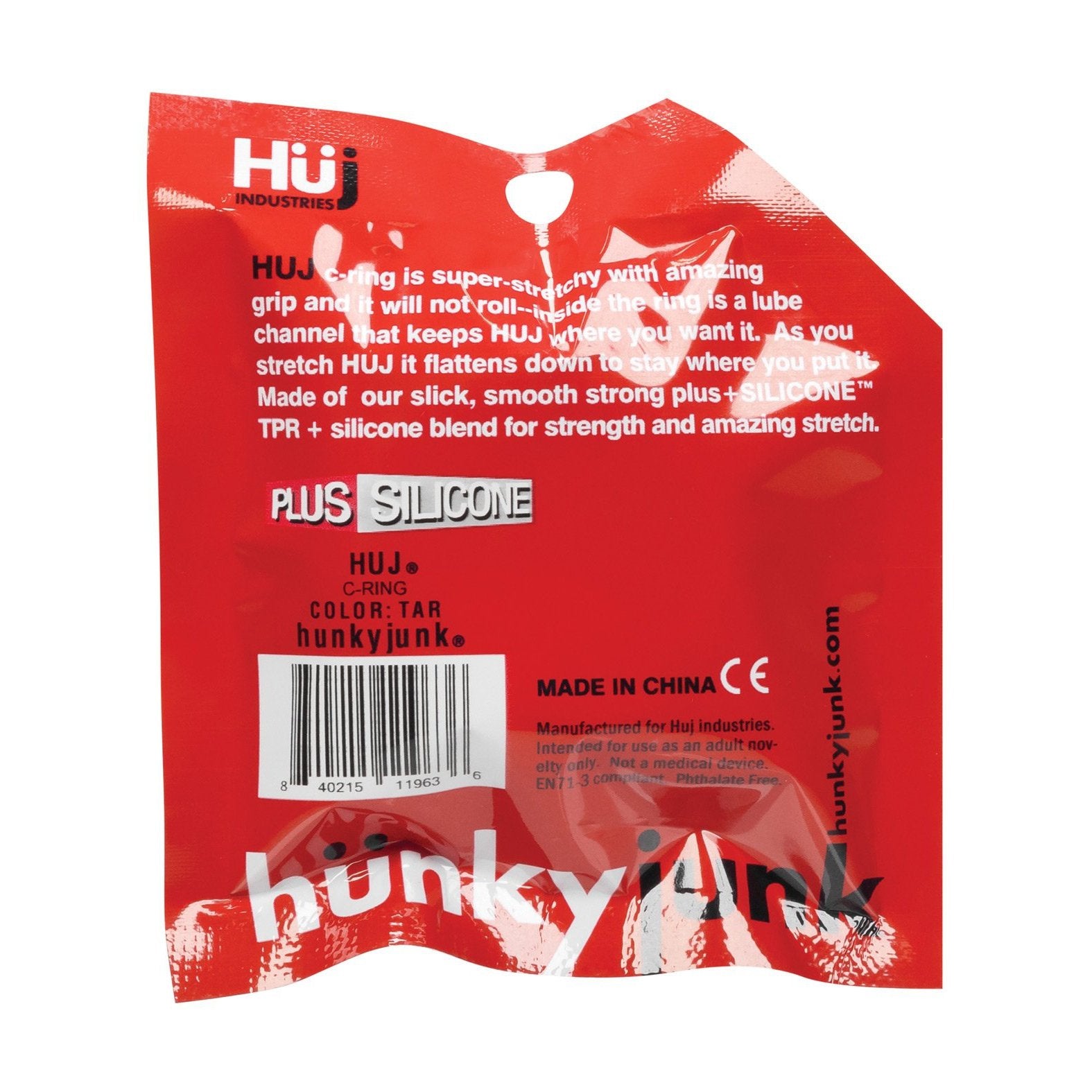 The red packaging features white and black text with logos, describing the product as a Huj Ring in tar color. Known as the Hunky Junk C Ring, its made of a comfortable, strong silicone blend. Crafted in China, it includes a barcode and brand name Hunky Junk.