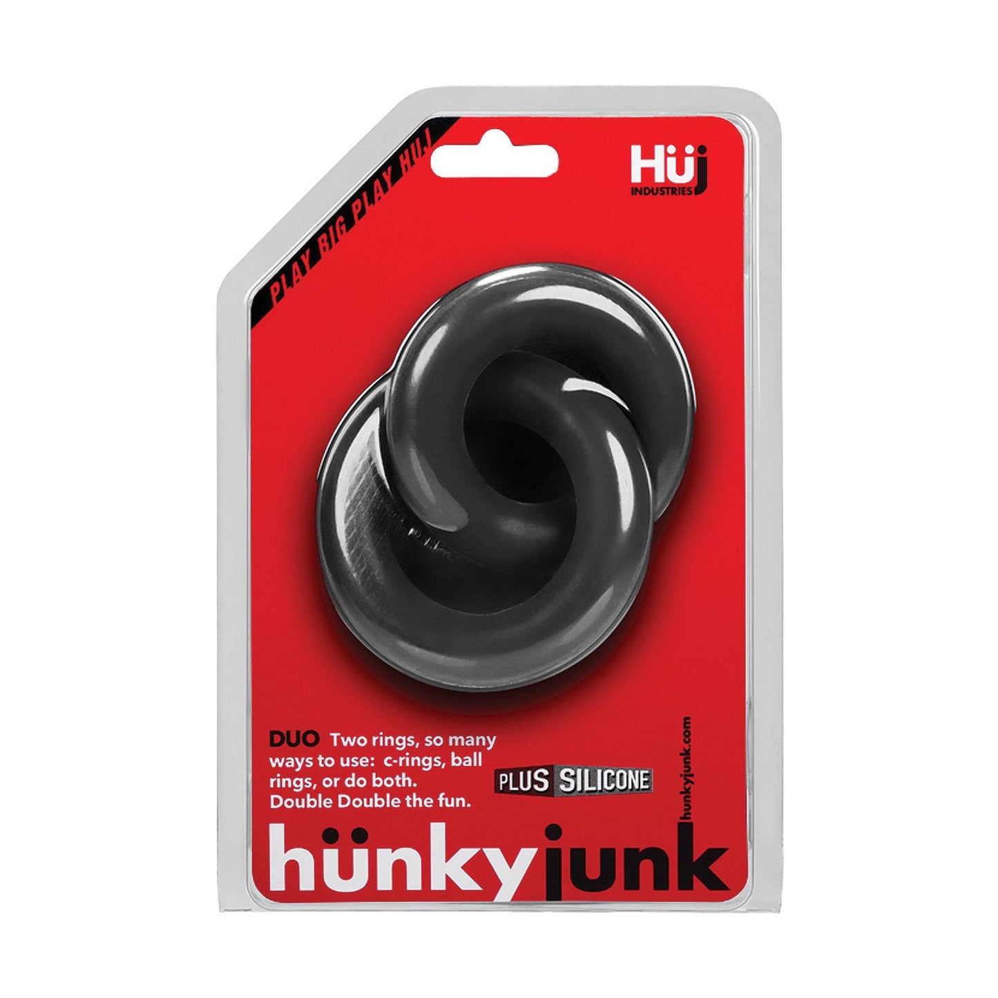 The package contains two black silicone C-ring design rings. The red and white packaging displays the brand name Adams Toy Box and product name Hunky Junk Duo Linked Cock & Ball Rings. Made from a TPR/silicone blend, they promise flexibility and durability.